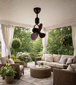 Decorative mini ceiling fan with wooden blades installed in a balcony sit-out area