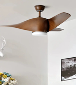 Ceiling fan with wooden blades in a room with a white wall