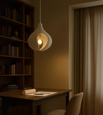 Minimal sculptural pendant light in white – modern handcrafted foam lighting for calm interiors.