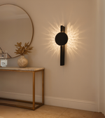 Lumina black wall lights mounted in a modern luxury living room