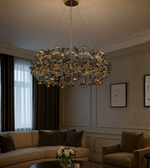 Florenza smoke crystal floral chandelier glowing in a living room.