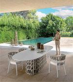 Daya Worldwide Liora outdoor dining set with a table and chairs, ideal for patio or garden outdoor dining spaces.
