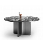 Round obsidian dining table with sleek black surface and sturdy base, perfect for modern dining rooms.