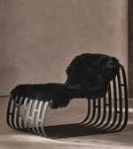 Daya Worldwide Noir Sculpt Lounge Chair in black fabric with a sleek, modern design and curved armrests.