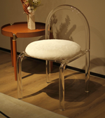 Clear frame chair by Daya Worldwide featuring transparent acrylic legs and a sleek modern design.