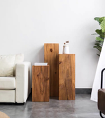 Wood display pedestal from Daya Worldwide, showcasing a sleek, natural wood surface ideal for decorative items or artwork.