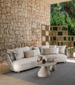 Outdoor lounge collection with stylish seating and coffee table, featuring cushions and modern design by Daya Worldwide.