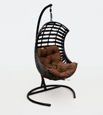 Outdoor hanging lounge chair by Daya Worldwide featuring a sturdy frame and cozy fabric seat for relaxing outdoors.