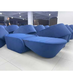 Blue BluMelt sofa bed by Daya Worldwide, showing a modern sofa that converts into a comfortable bed with sleek design and fabric upholstery.