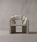 Daya Worldwide ARQ Chair armchair with modern design, plush upholstery, and sleek wooden legs, ideal for contemporary living rooms.