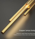Brass linear LED wall light with copper body close-up