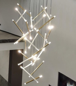 Modern chandelier hanging from the ceiling in a home setting