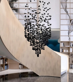 Modern staircase with black decorative elements in a stylish interior setting.