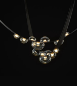 Necklace with glass beads on a black background