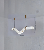 Modern pendant light fixture with white marble-like design on a gray background
