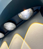 Close-up of a car's headlight with a blurred background