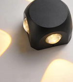 Modern black wall light fixture on a white background