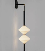 Modern wall lamp with geometric design on a gray background