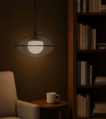 Modern pendant light fixture in a dimly lit room with a bookshelf and chair.