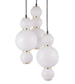 Modern pendant light with white glass spheres and gold accents on a white background
