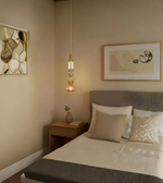 Modern bedroom with a bed, nightstand, and wall art.