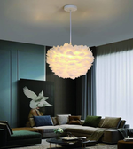 Modern living room with a decorative pendant light fixture.