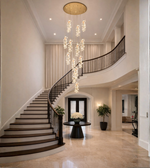 Luxury multi drop crystal pendant chandelier installed in a double height foyer and staircase
