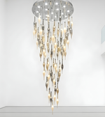 Modern chandelier with glass droplet design on a white background