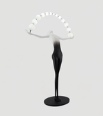 Modern black and white sculpture on a gray background