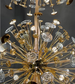 Gold and crystal chandelier against a dark background