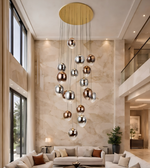 Modern living room with a large pendant light fixture.