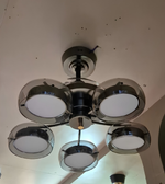 Chandelier with five light bulbs on a ceiling