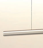 A modern linear LED pendant light with a slim rectangular silver and white body, suspended by a thin black cord against a plain off-white background.