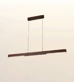 A modern linear LED pendant light with a dark brown wood-grain finish, suspended by two thin cables from a matching horizontal ceiling canopy against a plain off-white background.