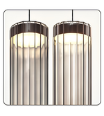 Two cylindrical pendant lights with ribbed glass shades on a white background