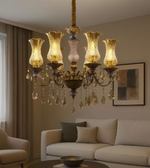 Luxurious chandelier hanging above a living room with a sofa and decor.
