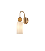 A modern wall-mounted light fixture with a curved brass arm, a round wooden finial, and a frosted glass shade that glows with warm light, shown against a plain white background.