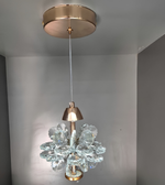 Chandelier with crystal design hanging from a ceiling fixture.