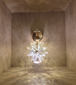 Decorative wall light fixture with crystal design in a neutral setting