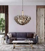 Modern living room with a chandelier, gray sofa, and wooden coffee table.