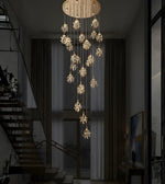 Elegant floral crystal cascade staircase chandelier by Daya Worldwide, double height design with intricate crystal details.