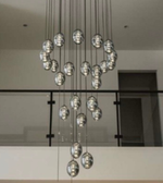 Modern chandelier with glass spheres hanging from the ceiling.