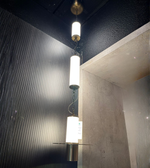 Triple cylinder alabaster pendant light by Daya Worldwide, featuring three cylindrical alabaster shades hanging from a sleek fixture.
