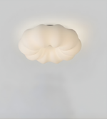 Cloud-shaped light fixture on a gray background
