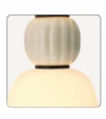 Modern pendant light fixture with two spherical shades on a white background