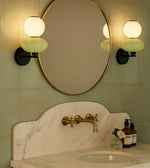 Daya Worldwide ORBA wall light with sleek modern design, mounted on a wall, emitting warm ambient glow.