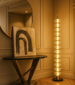 Daya Worldwide Lumina Tower floor lamp with sleek modern design, standing tall with a slim metal base and a stylish lampshade