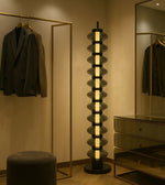 Modern Daya Worldwide Lumina Tower floor lamp with sleek design and warm lighting, standing tall as a stylish home decor piece.