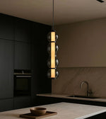 Pendant light from Daya Worldwide's RADIANT GLOW collection, featuring a sleek, modern design with warm illumination.