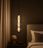 Daya Worldwide ORB GLOW Pendant hanging fixture with a sleek, modern design and warm ambient lighting.